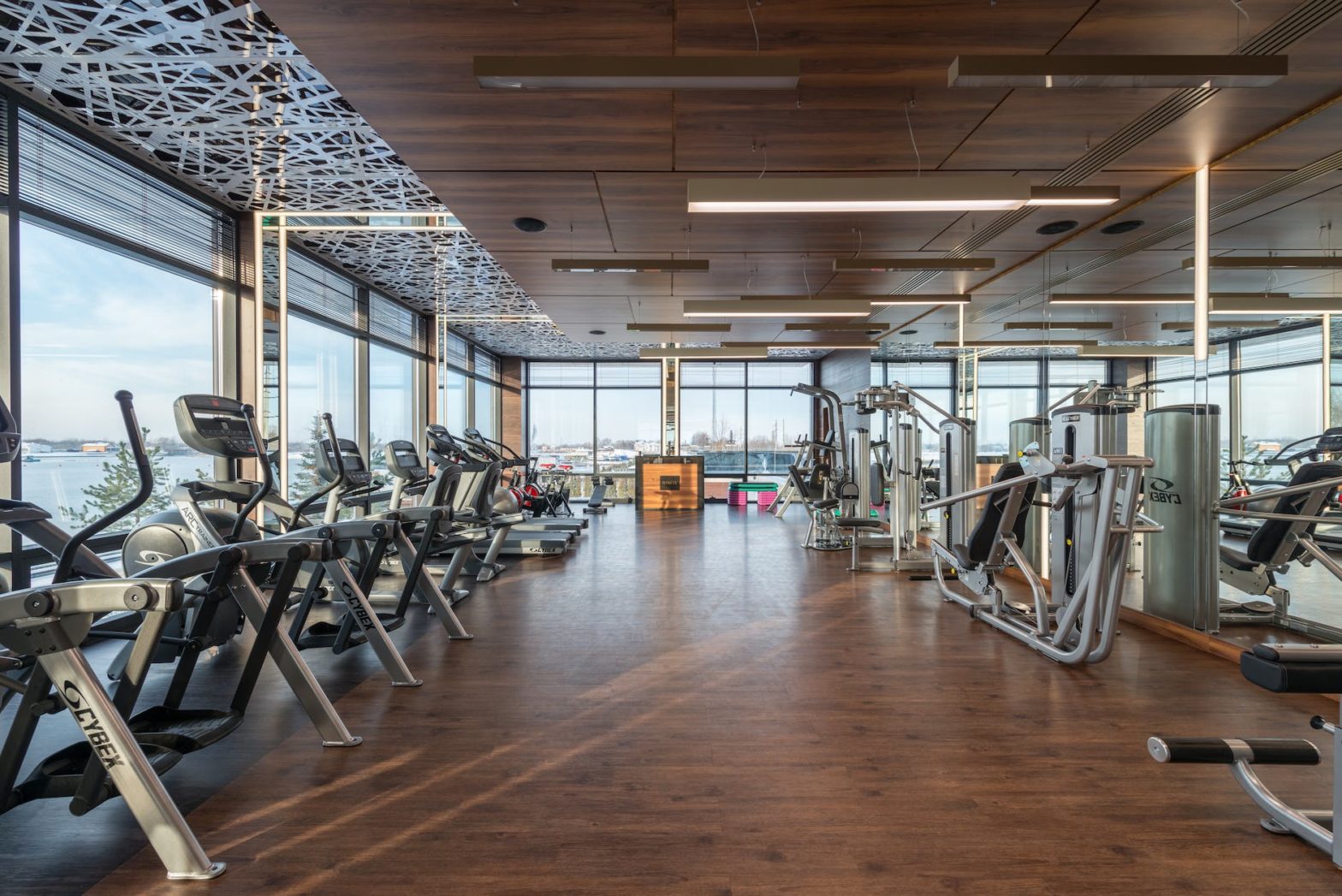 various fitness machines in modern spacious gym