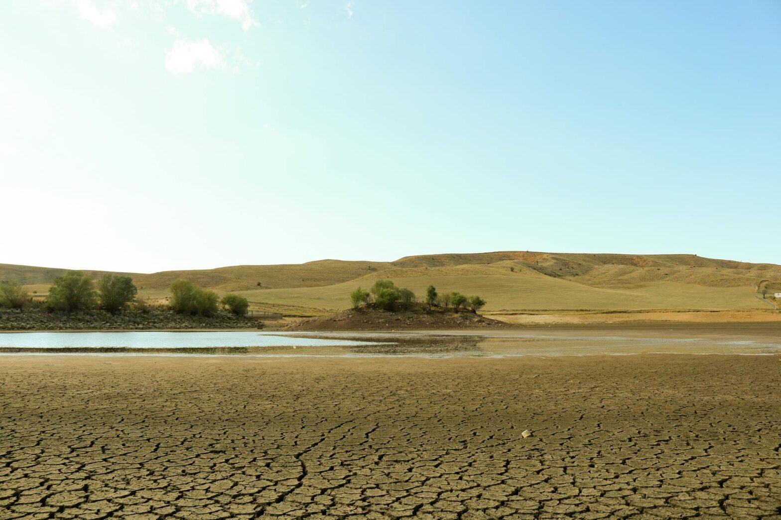 water in arid desert under the sky